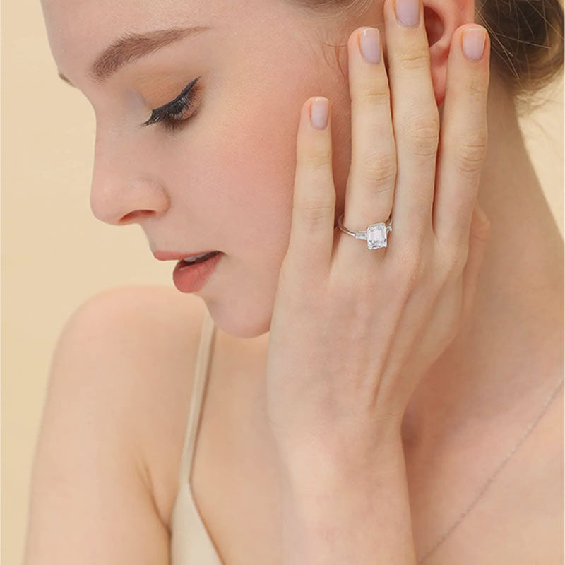 Emerald-cut three-stone ring