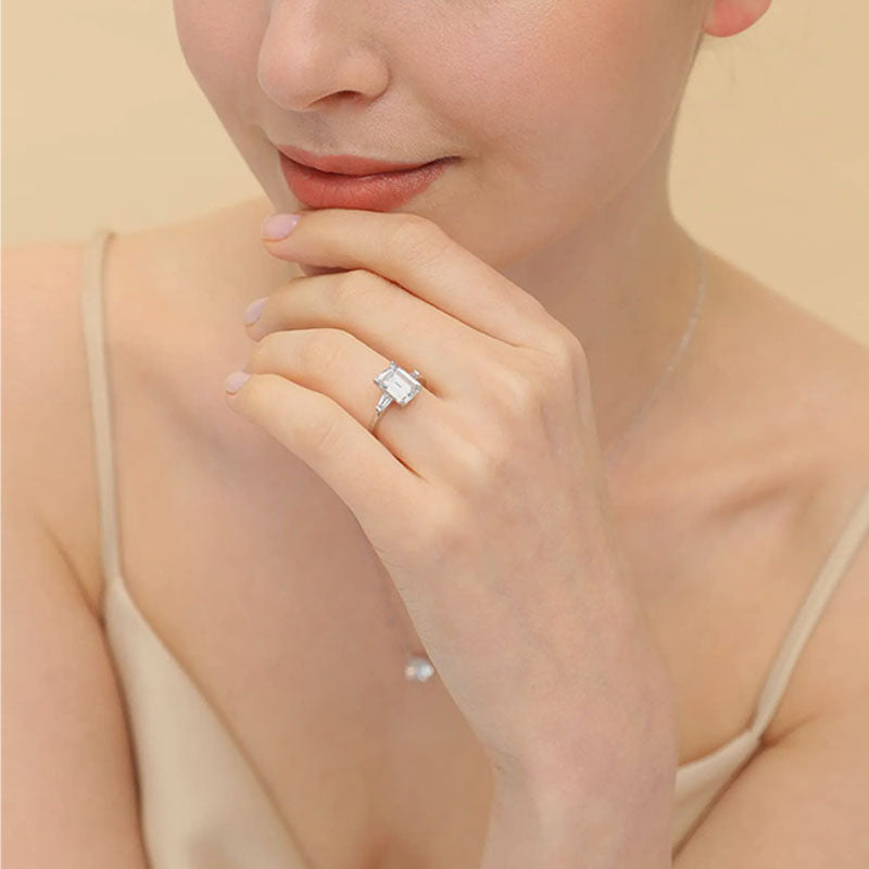 Emerald-cut three-stone ring