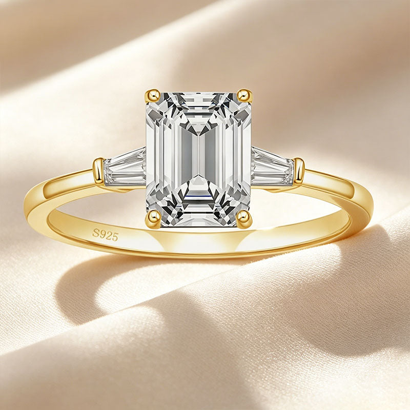 Emerald-cut three-stone ring
