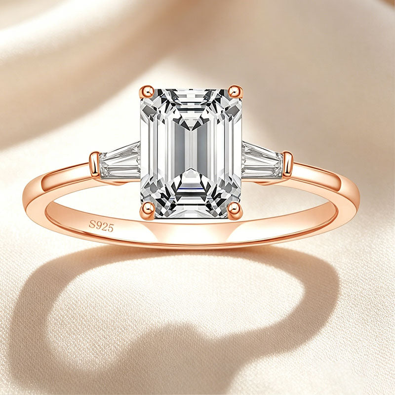 Emerald-cut three-stone ring
